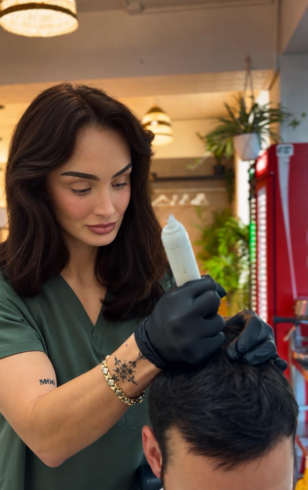 Amy carrying out scalp micropigmentation